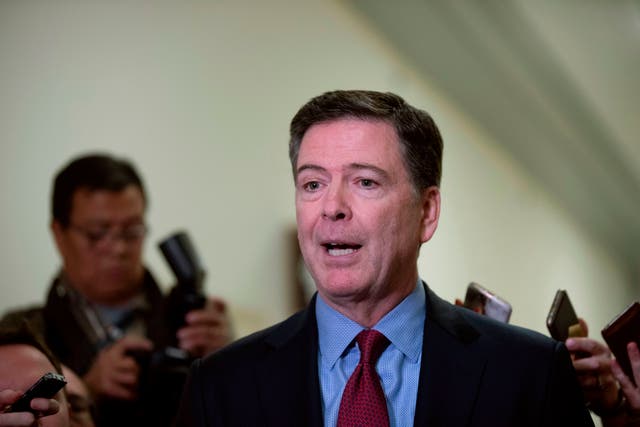 <p>Former FBI Director James Comey (C) talks to reporters following a closed House Judiciary Committee meeting to hear his testimony, on Capitol Hill in Washington, DC, on December 7, 2018</p>