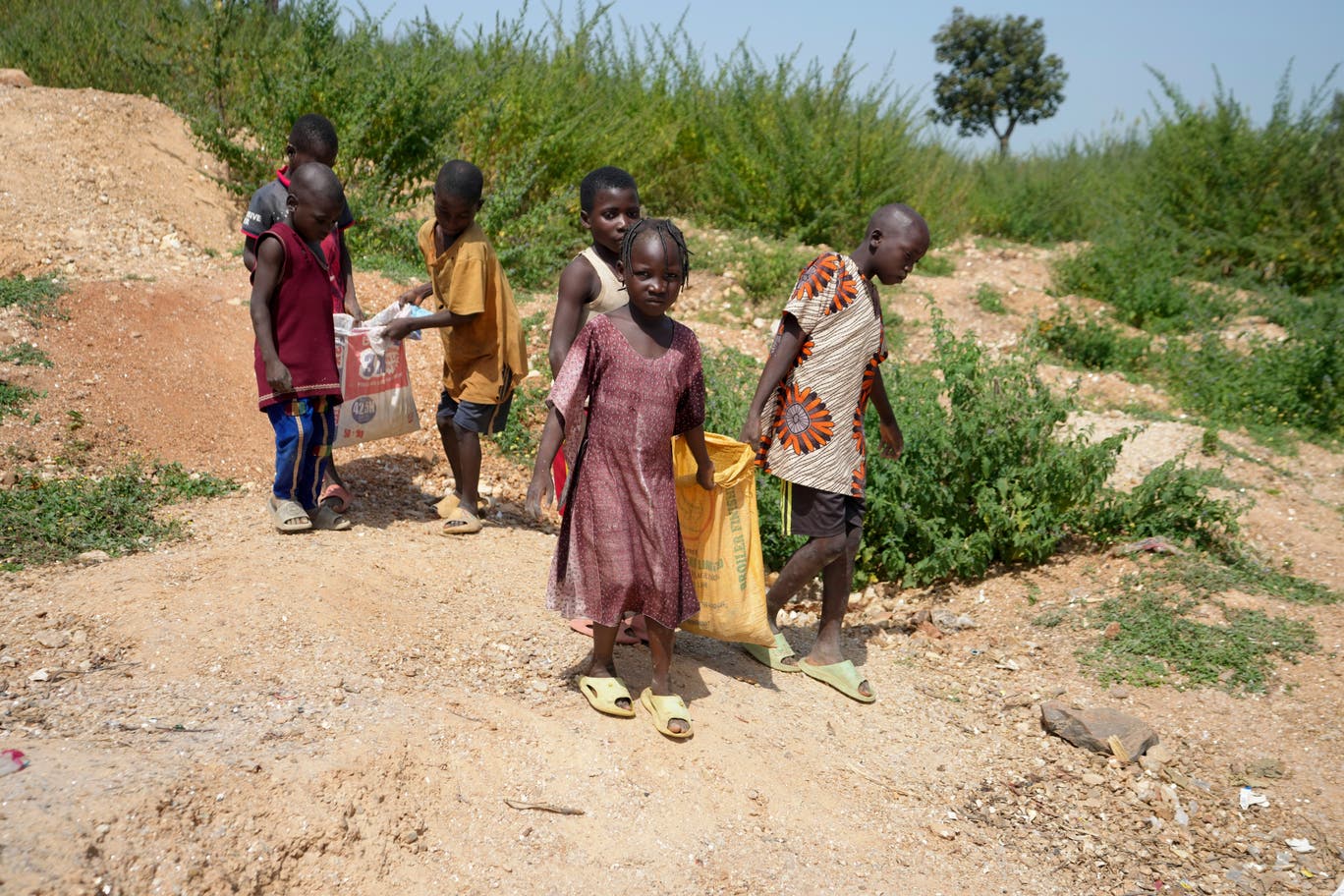 Children are photographed at an illegal lithium mine in Nigeria