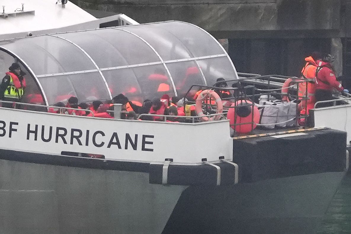 People wearing life jackets were pictured being brought ashore from a Border Force boat in Dover, Kent, on Thursday (Gareth Fuller/PA)