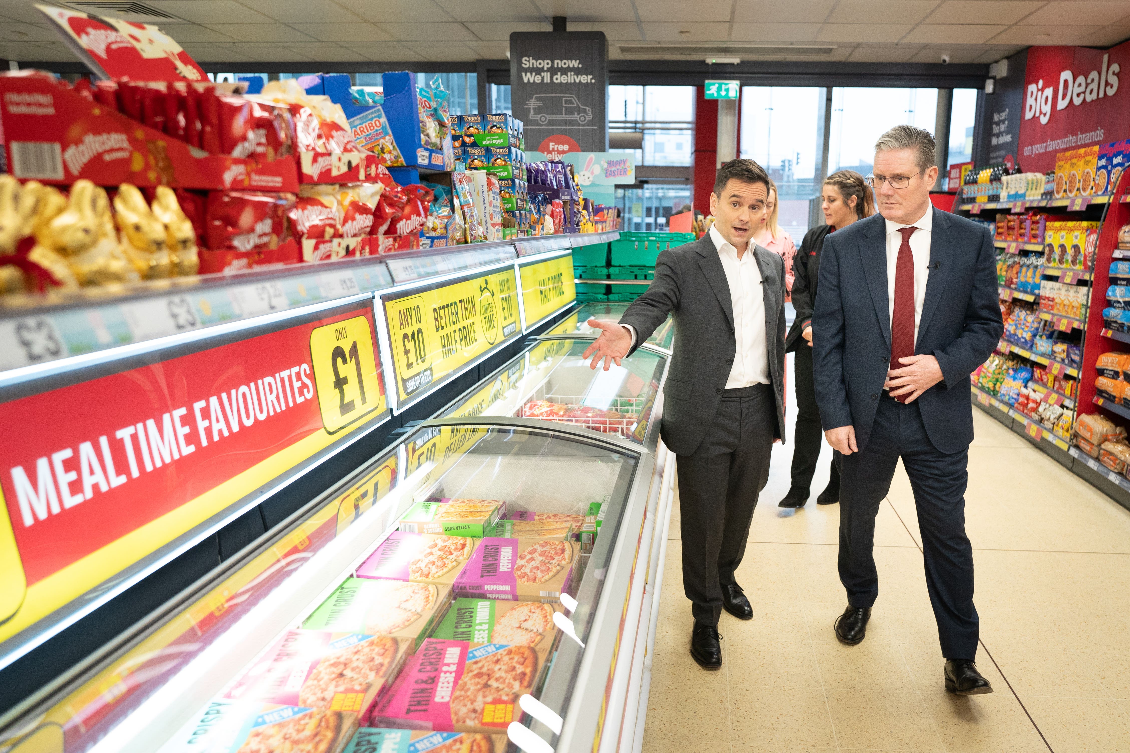 Labour leader Sir Keir Starmer (right) tours an Iceland supermarket in Warrington (Stefan Rousseau/PA)
