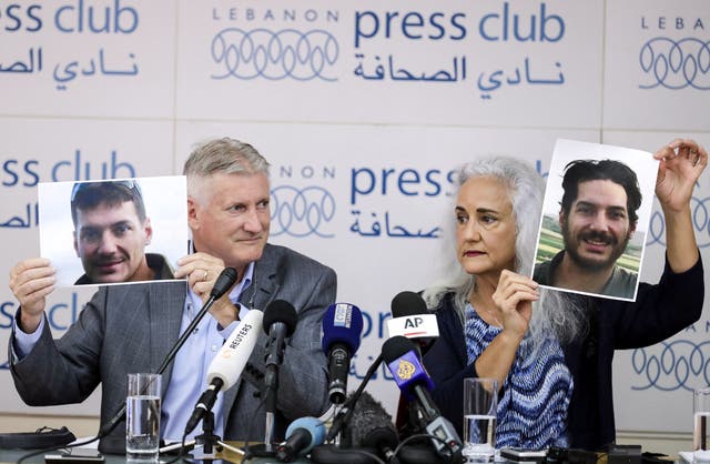 <p>Marc (L) and Debra Tice, parents of US journalist Austin Tice who was kidnapped in Syria five years prior, hold respective dated portraits of him during a press conference in the Lebanese capital Beirut on July 20, 2017</p>
