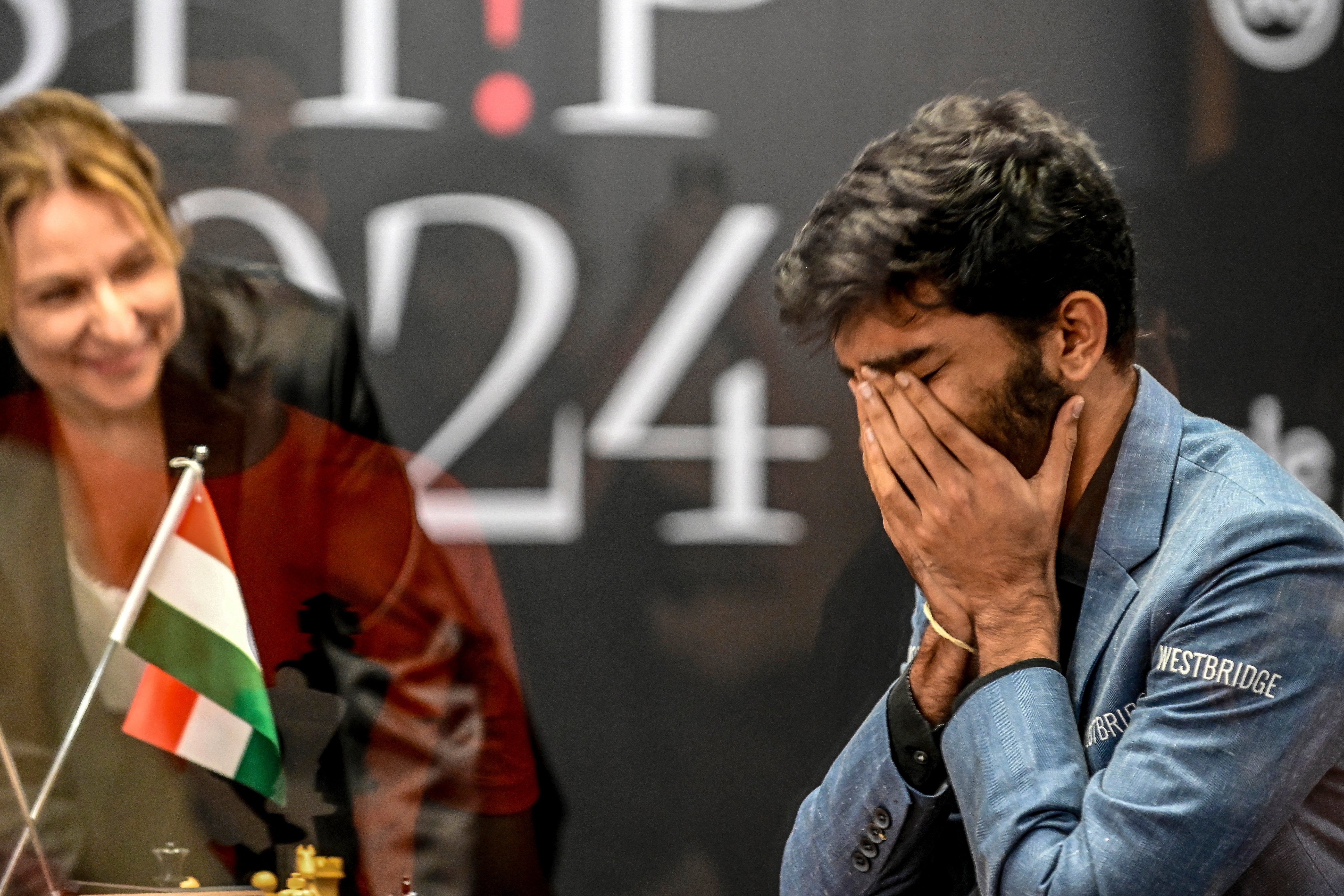 India's grandmaster Gukesh Dommaraju reacts after winning against China's Ding Liren