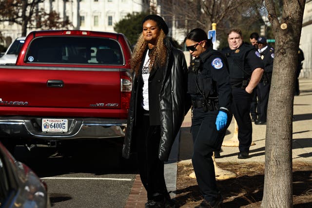 <p>Raquel Willis, left, is arrested by Capitol police while protesting in Congress against Republicans’ trans bathroom ban on Thursday Dec 5, 2024</p>