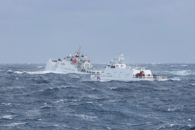 <p>A Taiwanese coast guard ship (R) monitoring a Chinese coast guard ship</p>