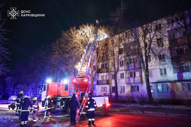 <p>In this photo provided by the Ukrainian Emergency Service, firefighters work on the site of a damaged building after a Russian drone attack in Kharkiv, Ukraine</p>