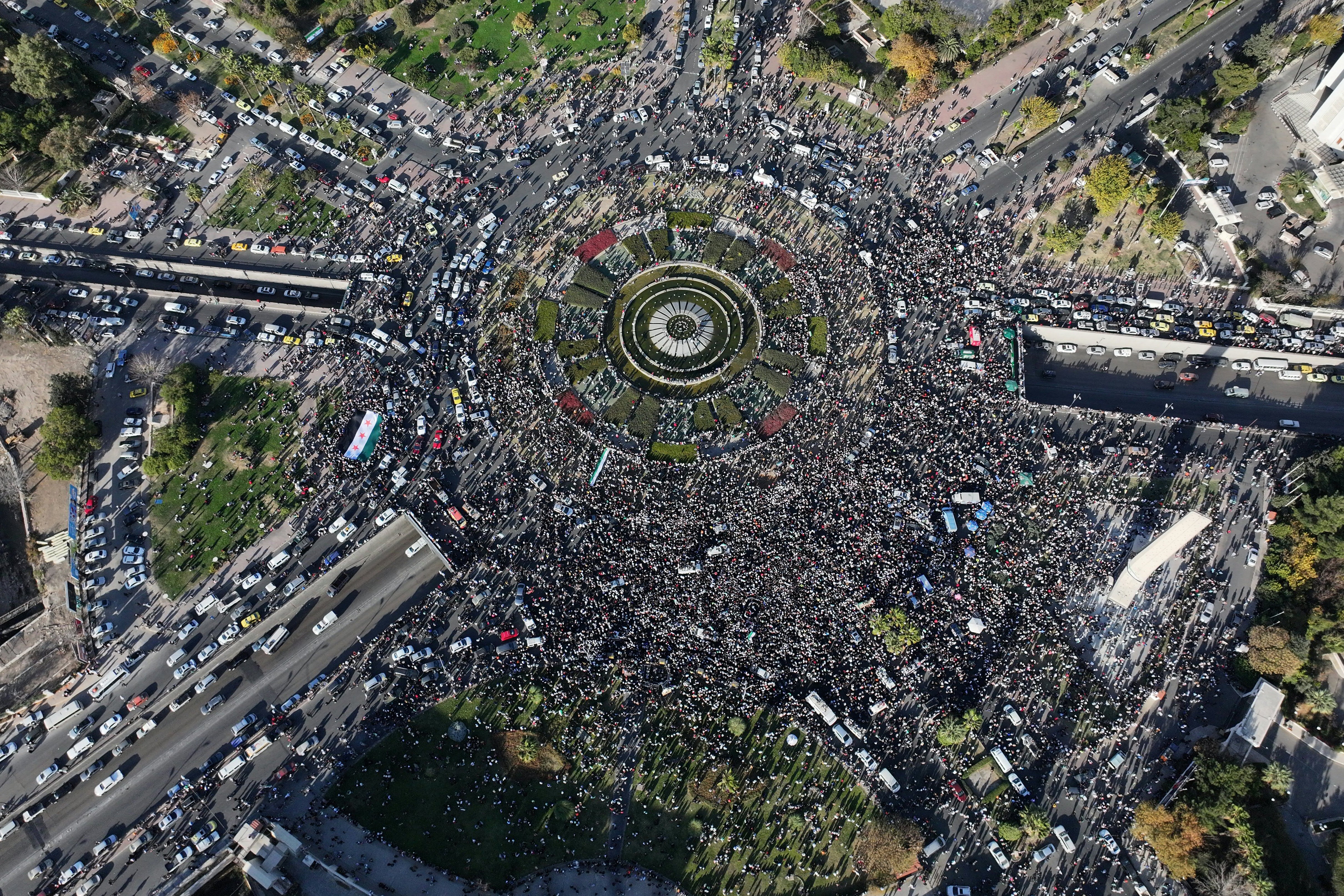 An areal photo shows thousands of jubilant Syrians celebrating this week's fall of Bashar al-Assad's iron-fisted rule