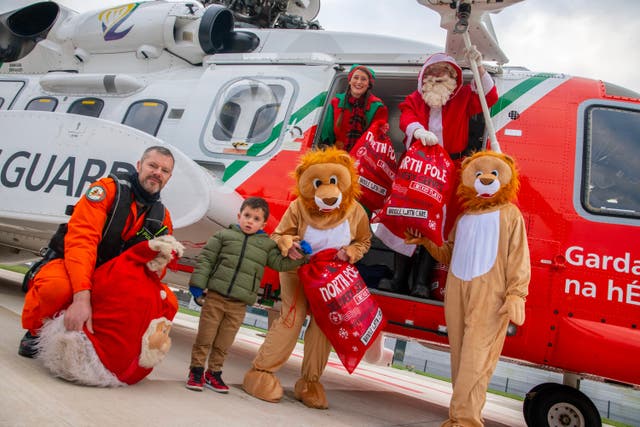 Santa arrived by Coast Guard helicopter to Cork University Hospital to deliver presents to child patients (Colm Lougheed/PA)