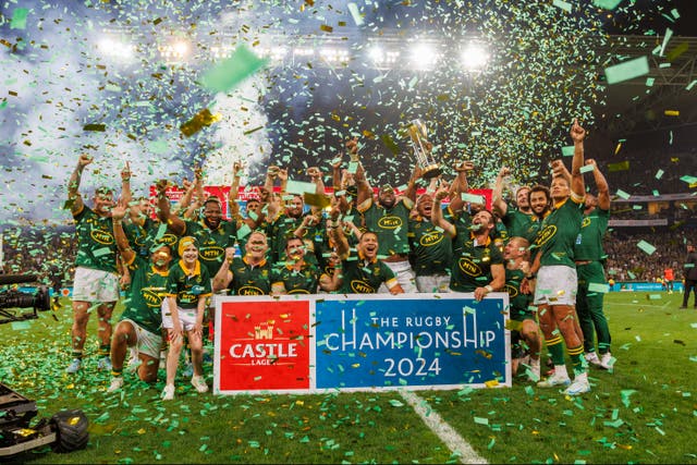 <p>Siya Kolisi of South Africa lifts the trophy with teammates after winning the Rugby Championship 2024</p>