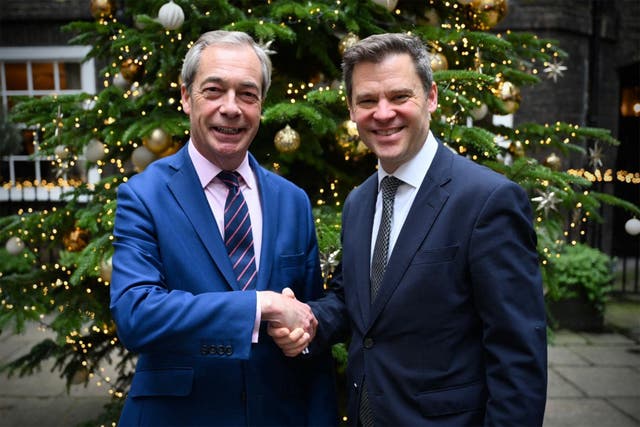 <p>Floorplay: Nigel Farage and fellow traveller Aidan Burley mark their union in understated fashion</p>