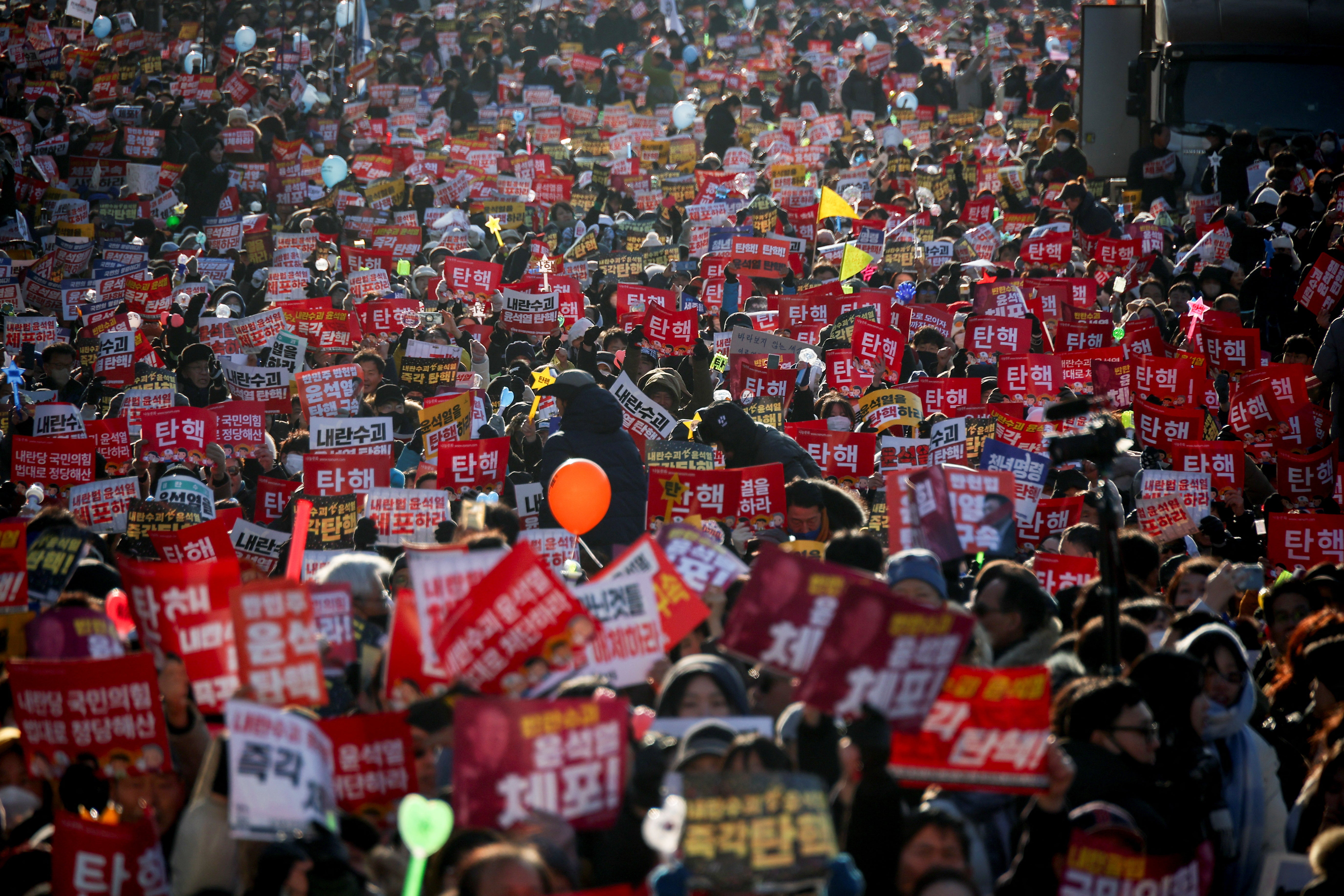 Protesters participate in a rally calling for the impeachment of South Korean President Yoon Suk Yeol, who declared martial law