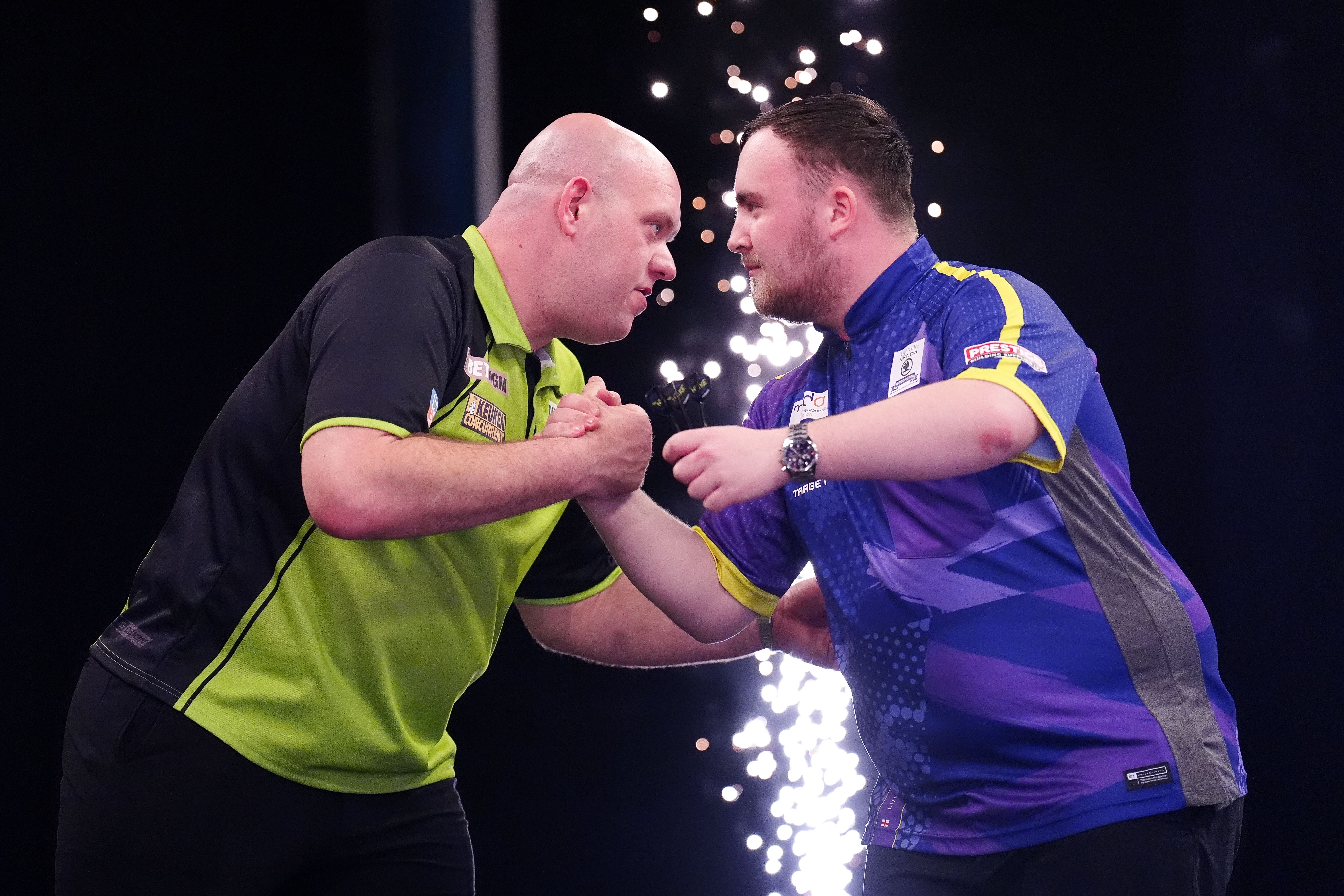 Michael van Gerwen embraces Luke Littler