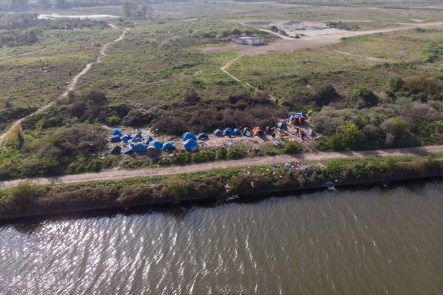 Migrants camp along the coast near Loon-Plage, Dunkirk (Alamy/PA)