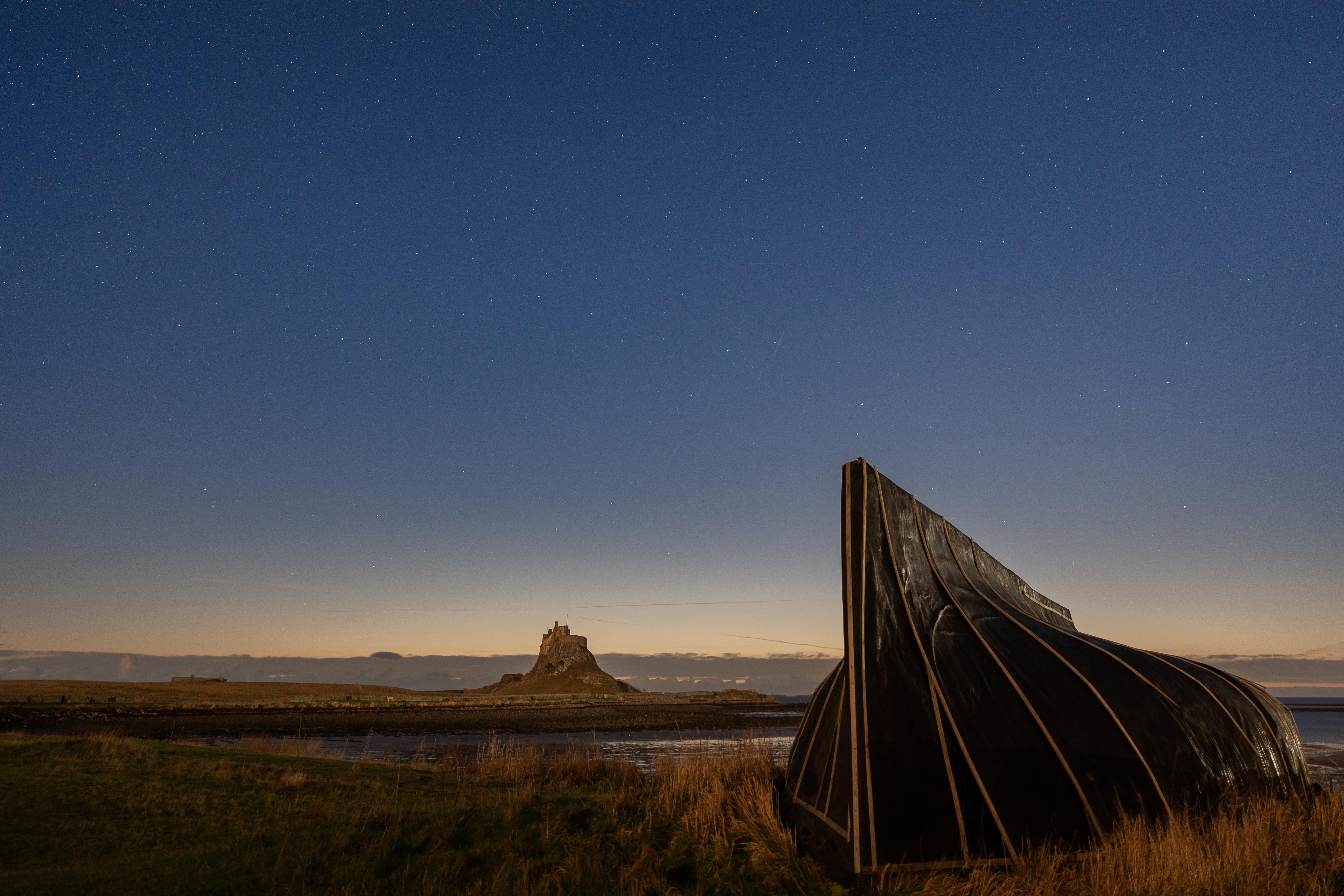 The Geminid meteor shower over Lindisfarne in Northumberland (Lee Reid/PA)