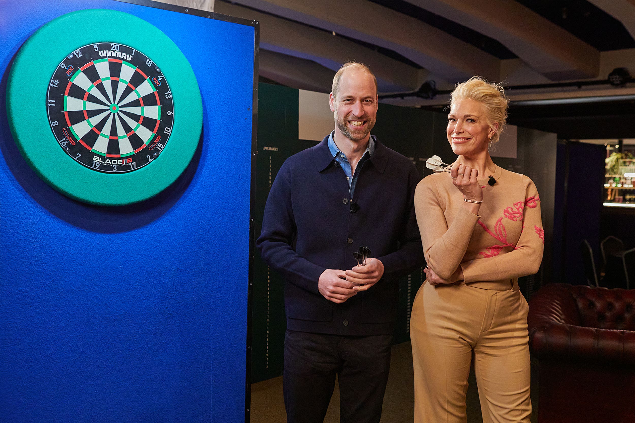 Prince of Wales and Hannah Waddingham discuss the Earthshot Prize over darts (Kensington Palace/PA)