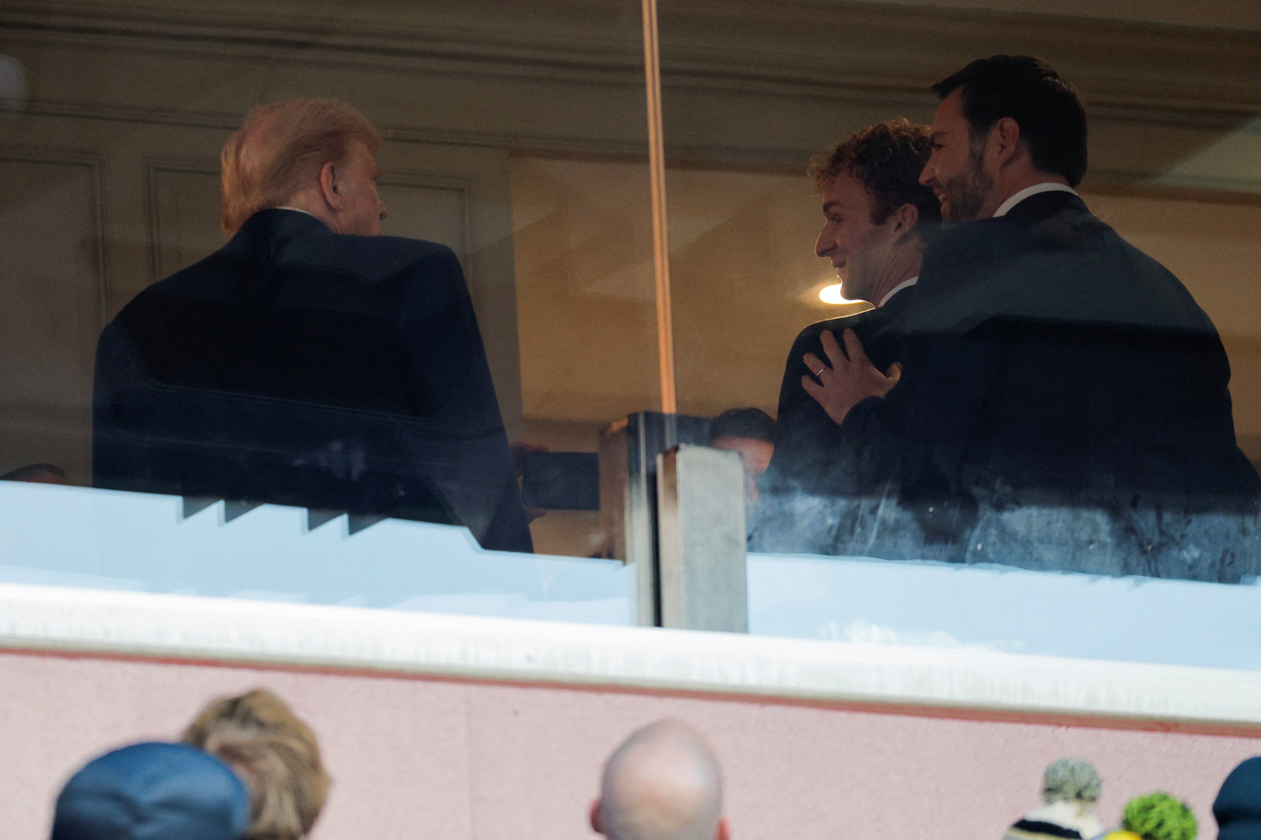 US President-elect Donald Trump, Vice President-elect JD Vance and Daniel Penny, a former US Marine who was found not guilty of criminally negligent homicide in the 2023 chokehold death of a man on a New York City subway train, attend the Army-Navy football game in Landover, Maryland