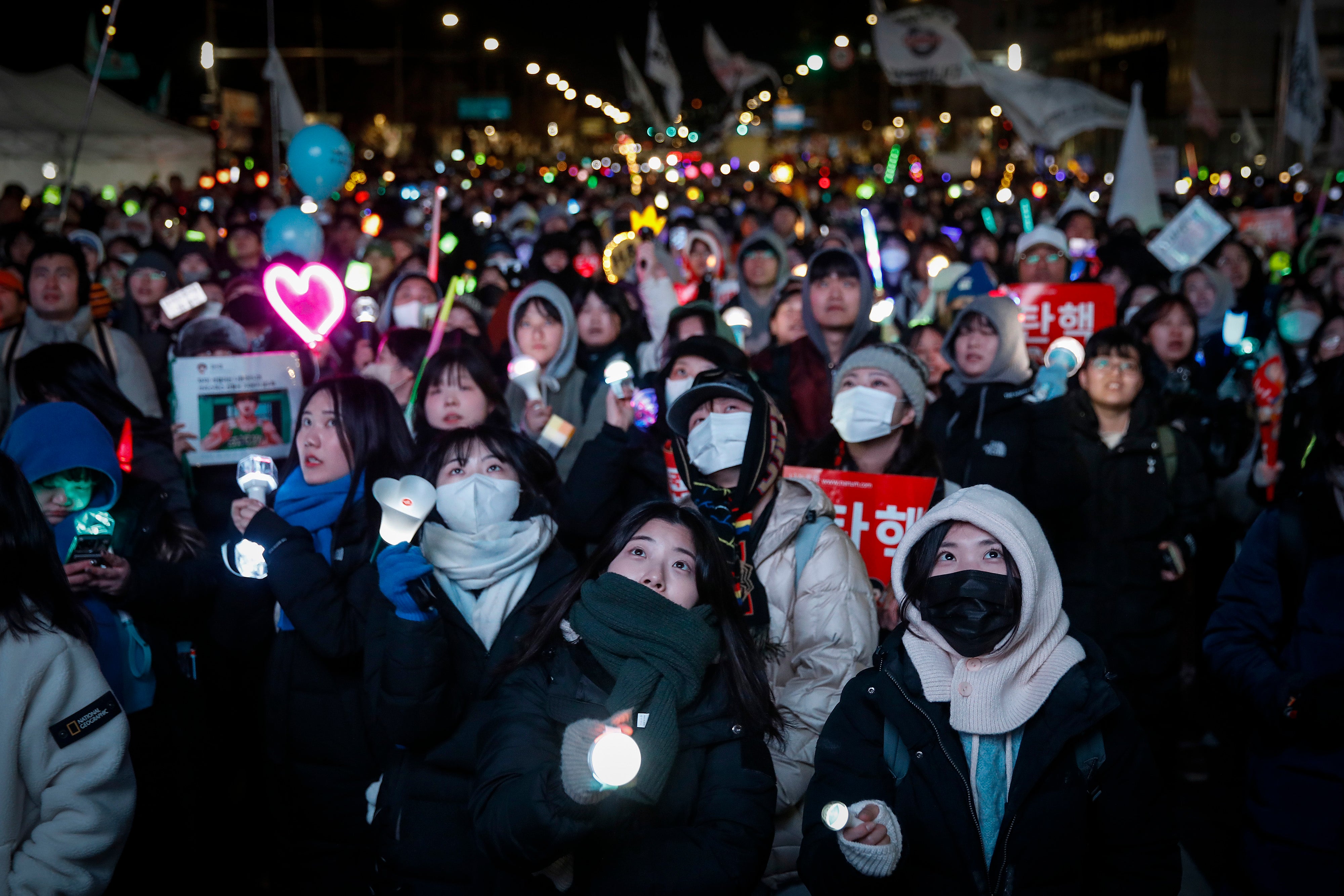 Protesters celebrate the impeachment of South Korean president Yoon Suk Yeol