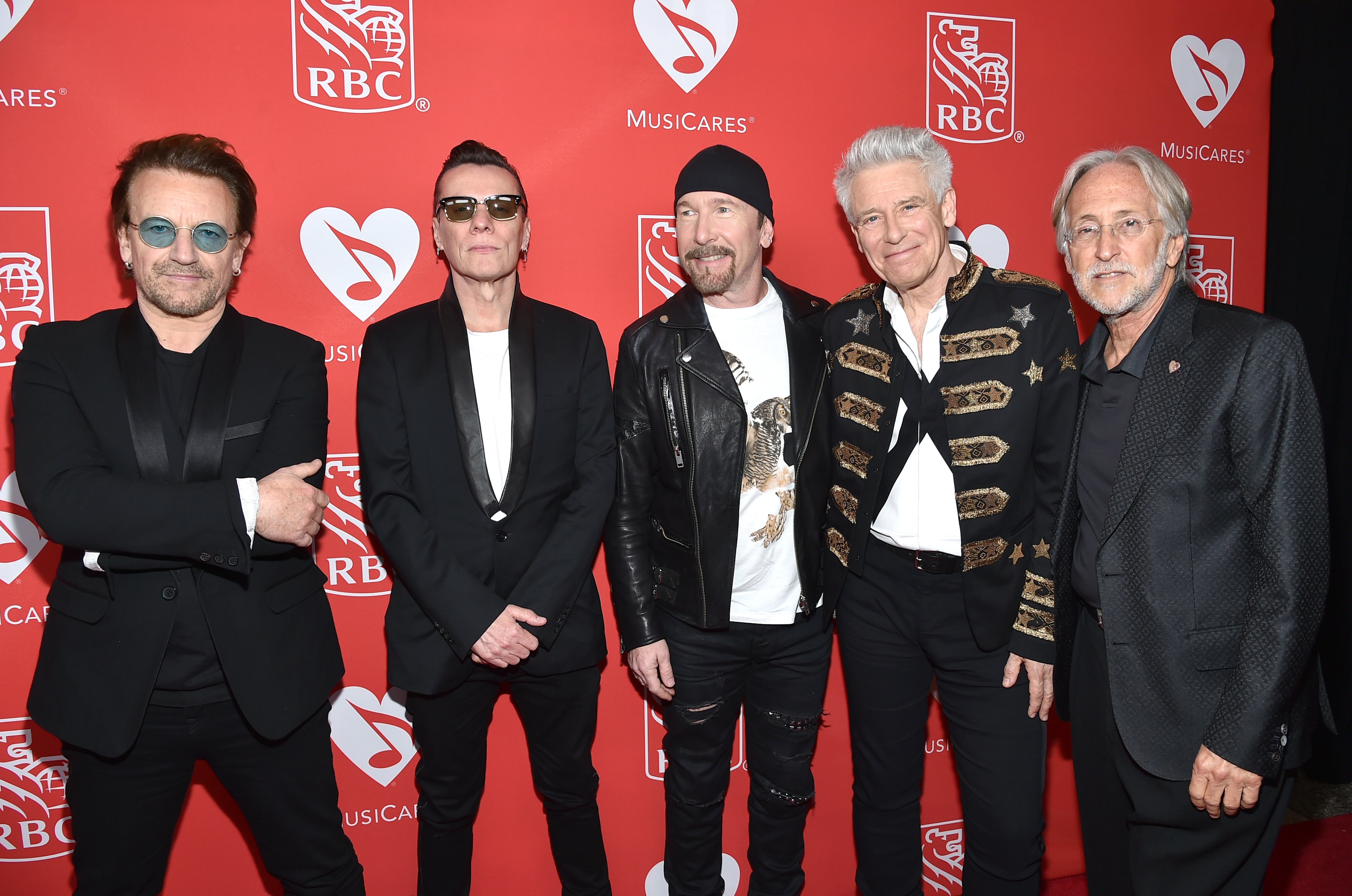 U2’s Bono, Larry Mullen Jr and The Edge pose with Adam Clayton in 2017