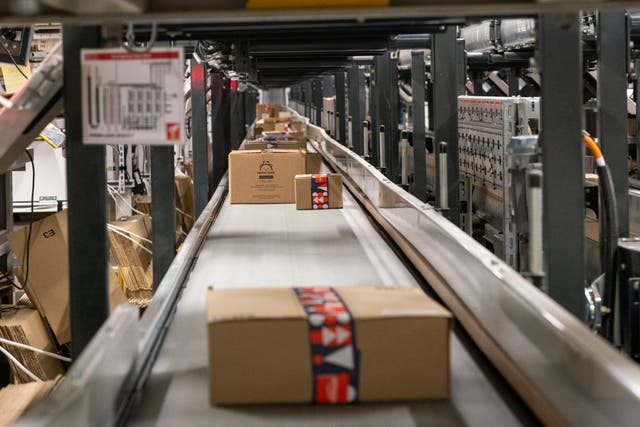<p>Parcels moving on conveyor belts at Amazon's fulfillment centre in Swindon, Wiltshire</p>