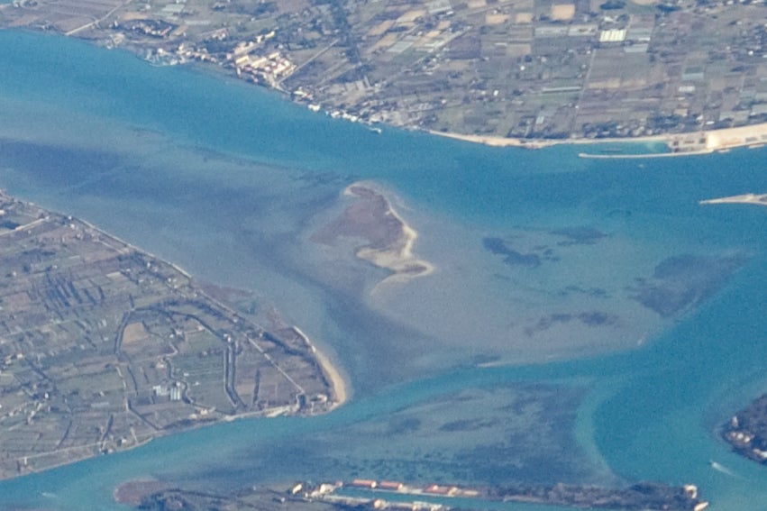 Bacan can be seen in the centre, the small clump of land with a sandy bank