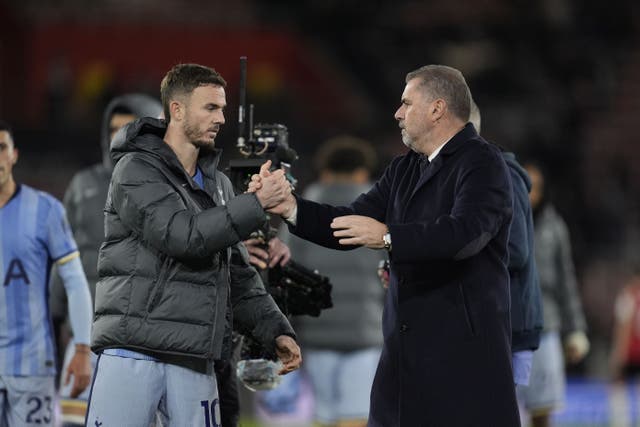 Ange Postecoglou, right, and James Maddison embrace after Tottenham’s 5-0 win at Southampton (Andrew Matthews/PA)