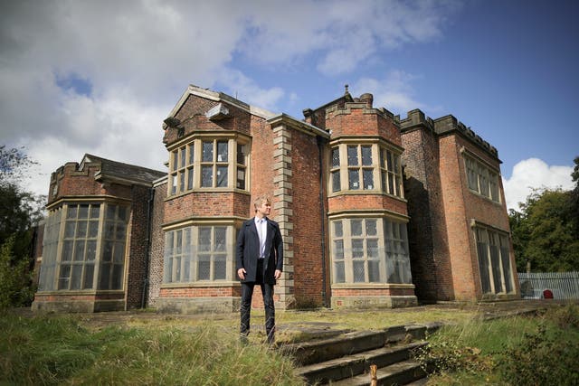 <p>Hopwood DePree outside Hopwood Hall, his family’s ancestral home</p>