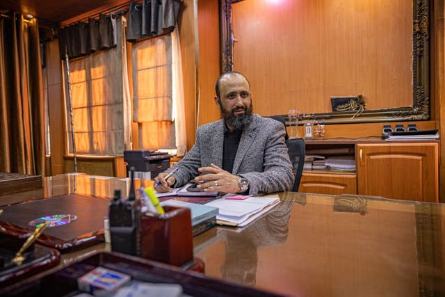 <p>Alaa Omran in his office as police chief of the city of Homs</p>