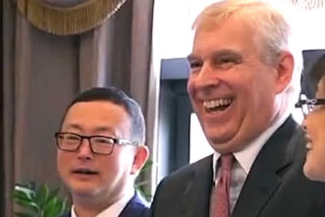 <p>Tengbo with Prince Andrew </p>