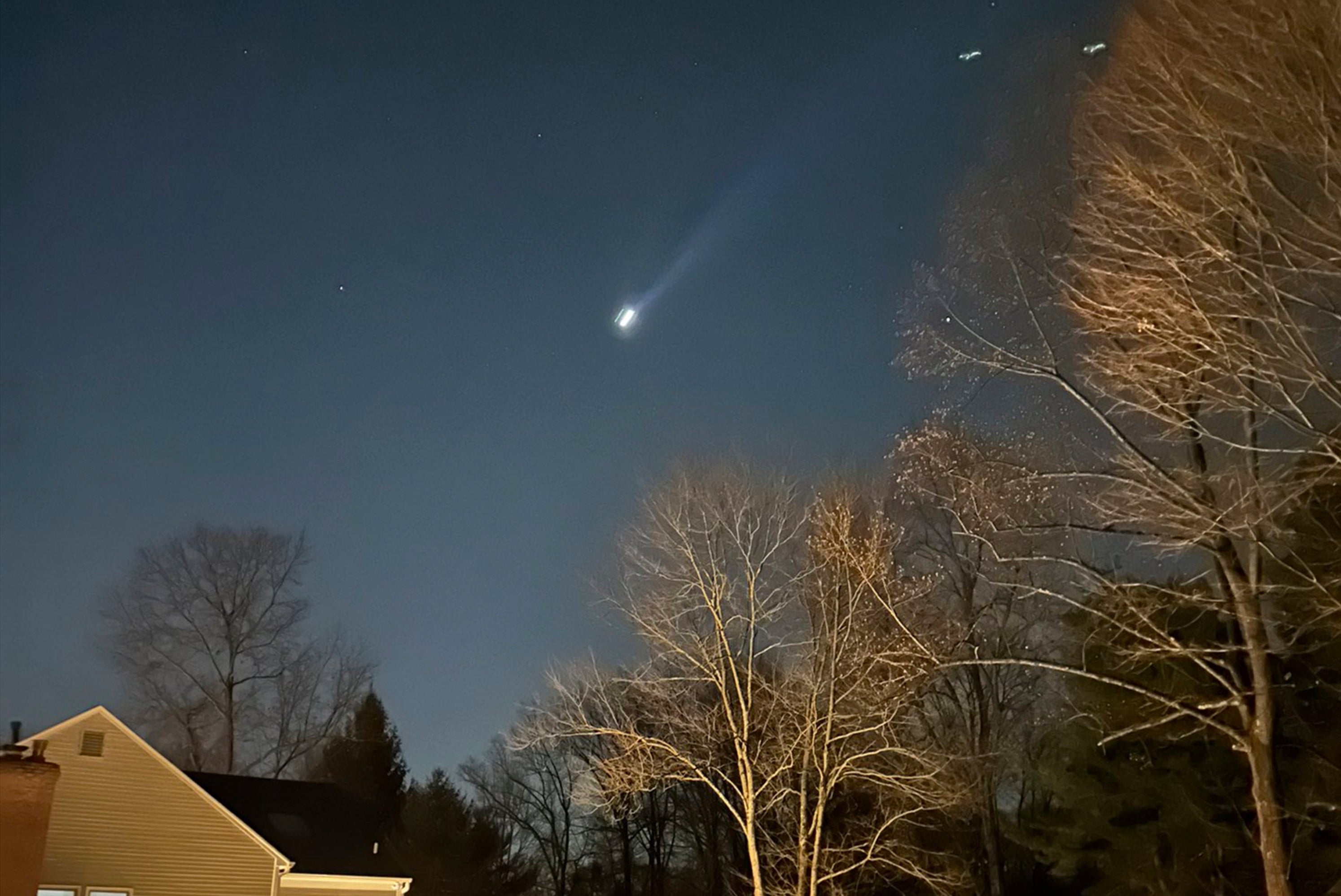 Image shows what appears to be multiple drones flying over Bernardsville, New Jersey, on December 5