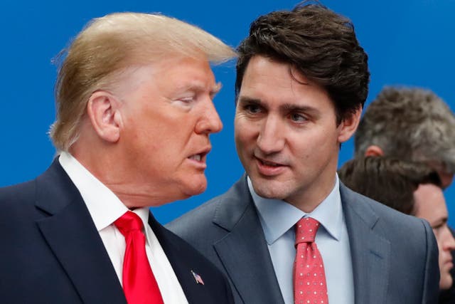 <p>President-elect Donald Trump and Canadian Prime Minister Justin Trudeau talk prior to a NATO roundtable meeting at The Grove hotel and resort in England in 2019.  Canada has admitted that migrants can easily ‘hop’ over the Canadian border to the U.S. after Trump threatened to impose large tariffs</p>