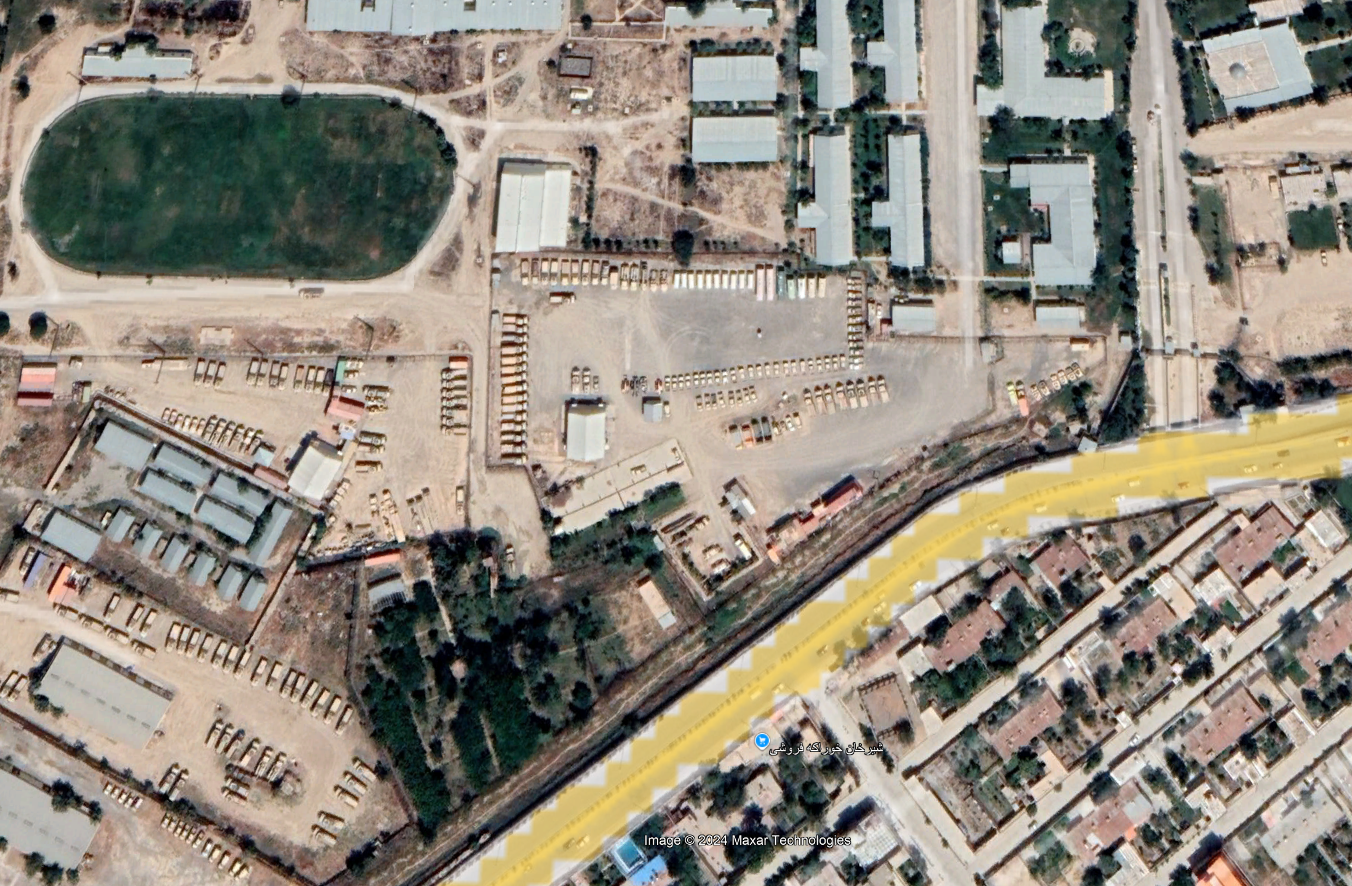 Satellite view of neatly parked humvees and other military vehicles near Kabul International Airport in 2019