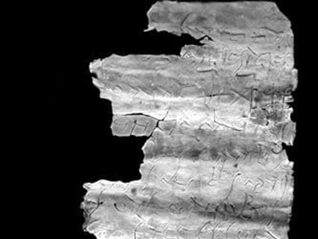 <p>The unrolled inscription inside third century amulet providing early references to the spread of Christianity </p>