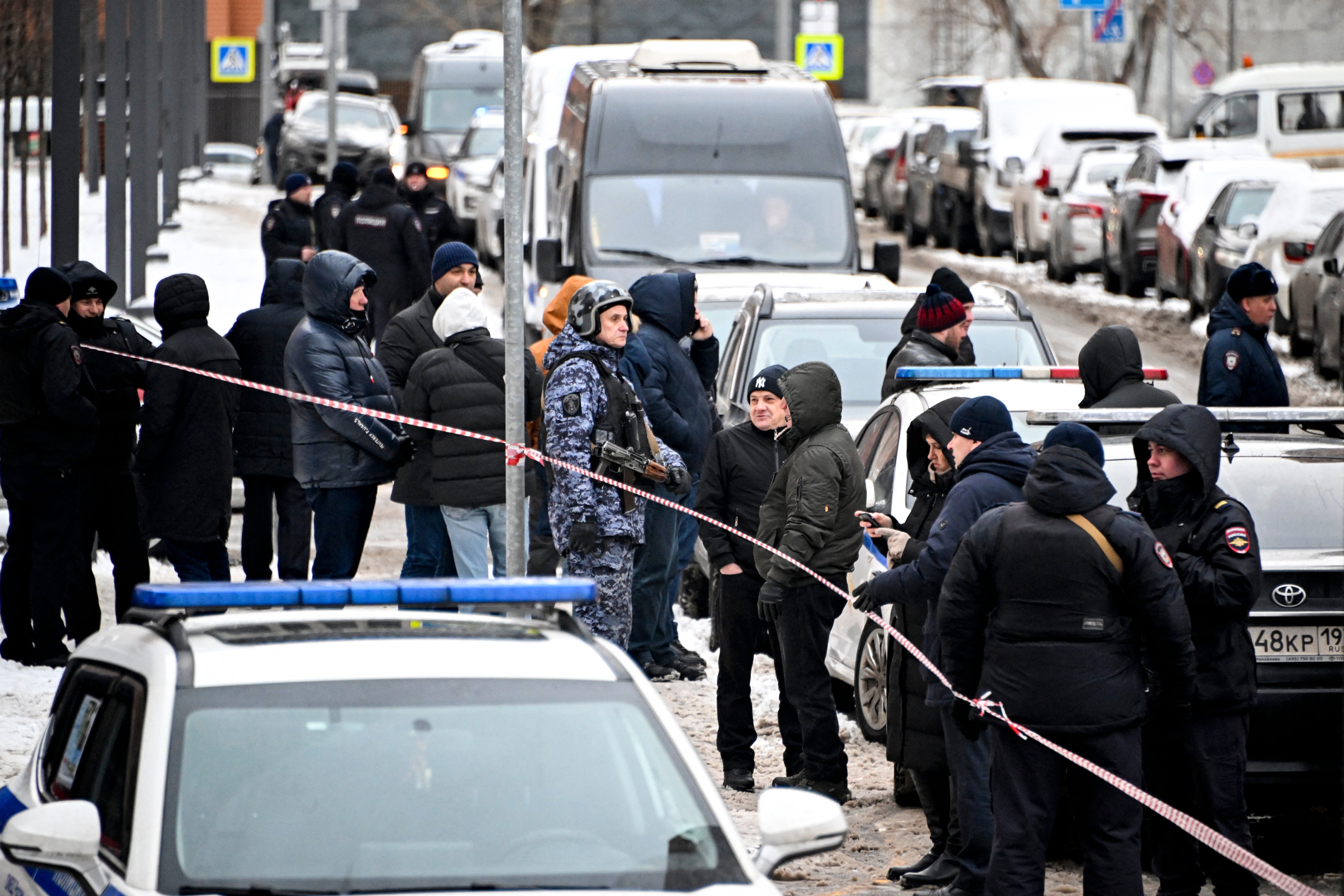 People gather outside the scene of an explosion that killed Russian commander Igor Kirillov in Moscow