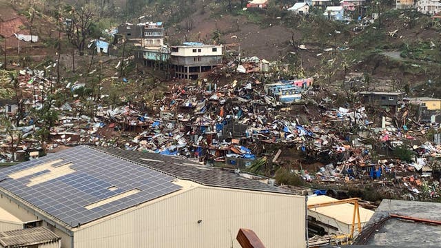 <p>A pile of debris of metal sheets, wood, furniture and belongings after the cyclone Chido hit France's Indian Ocean territory of Mayotte</p>