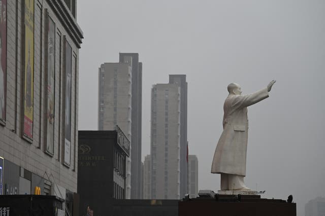 <p>A statue of late communist leader Mao Zedong stands outside a shopping mall in Baotou in China's northern Inner Mongolia region</p>