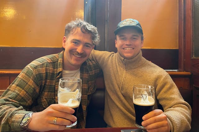 Cork natives Will O’Brien and Josh Ward enjoy pints of Guinness in Kehoes pub in Dublin city centre (PA)