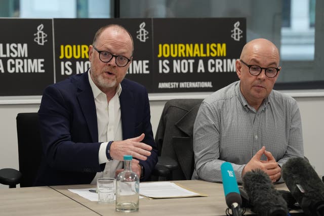 Journalists Trevor Birney (left) and Barry McCaffrey (Lucy North/PA)