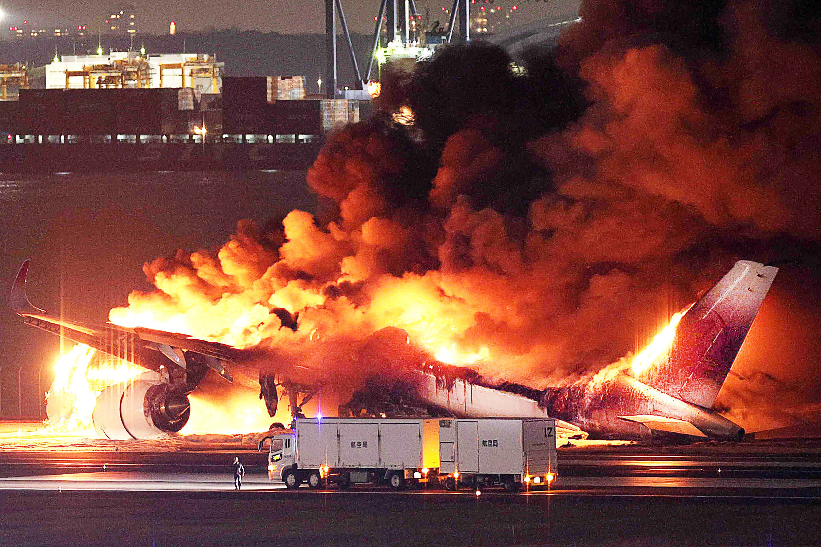 The Japan Airlines A350 in flames after landing in Tokyo in January. All 377 on board survived