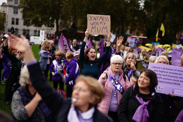 <p>Waspi campaigners stage a protest on College Green in Westminster, London</p>