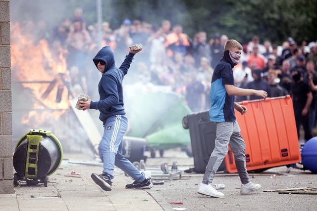 <p>Anti-migration protesters targeted a Holiday Inn Express housing asylum seekers in Rotherham as unrest erupted this summer </p>