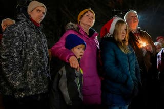 A family attend the vigil in Madison