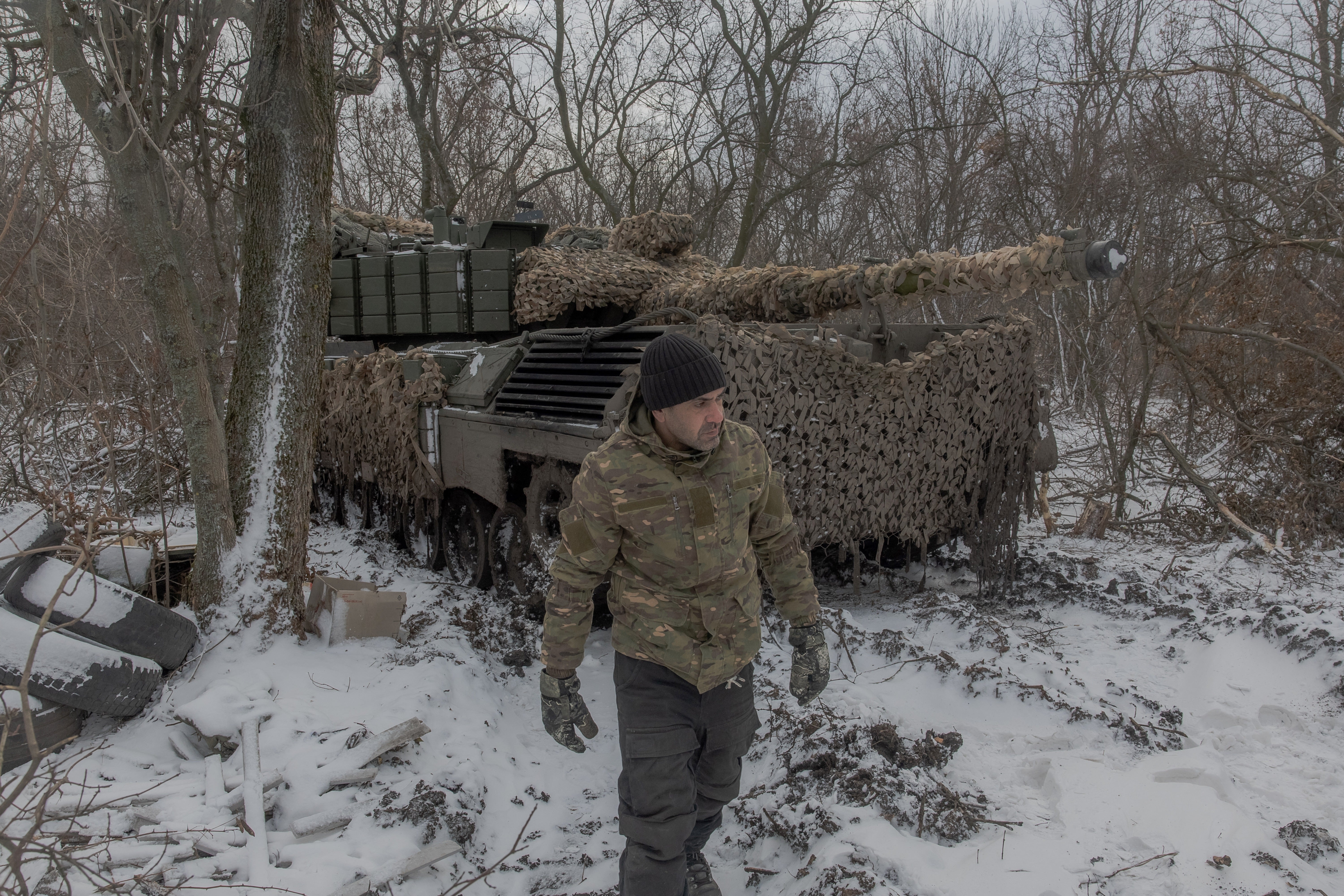 A Ukrainian tank crew member takes a break in fighting near Pokrovsk