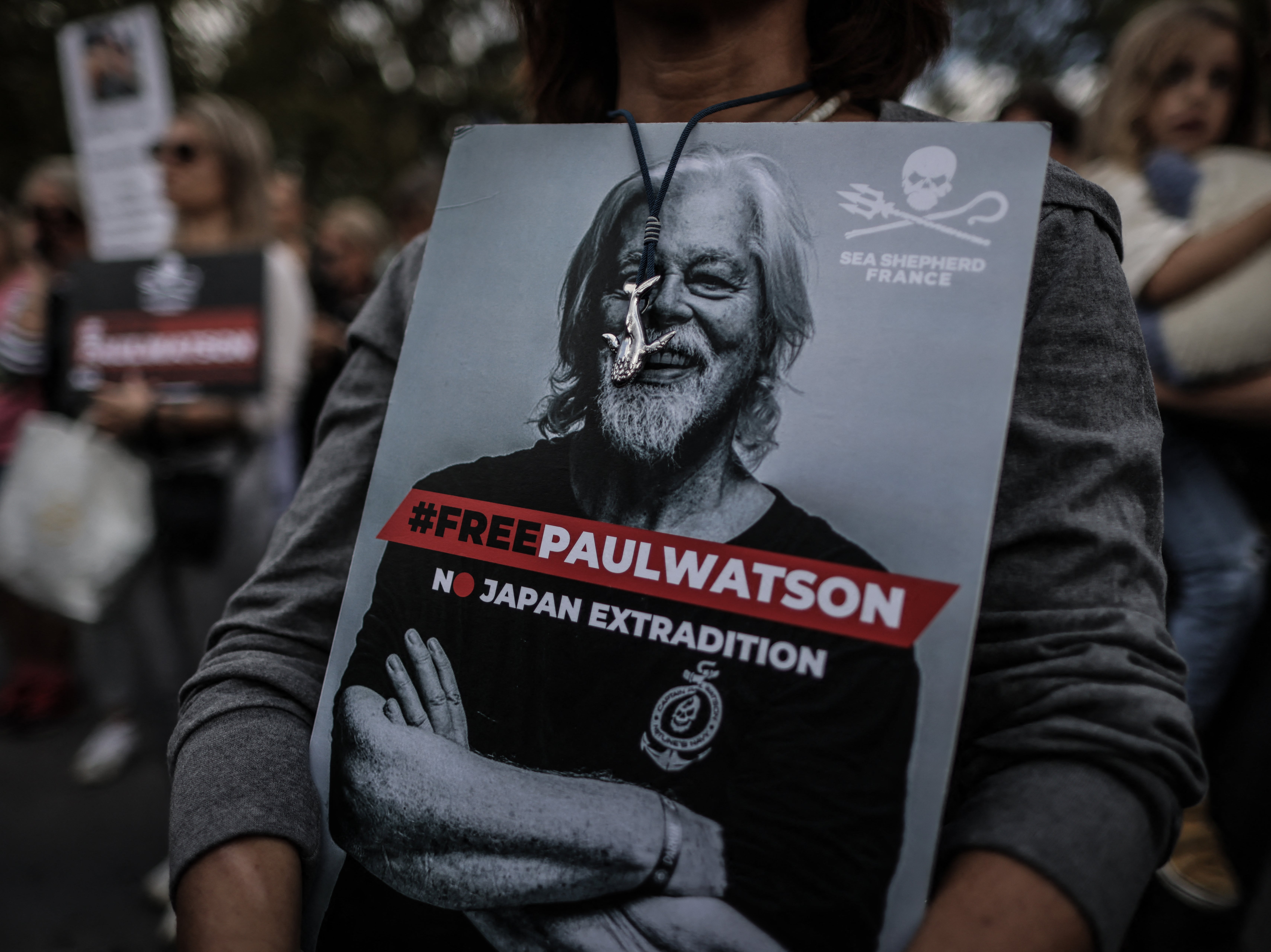 File. A protestor holds a sign displaying a portrait of Paul Watson during a demonstration in his support in Paris on 4 September 2024