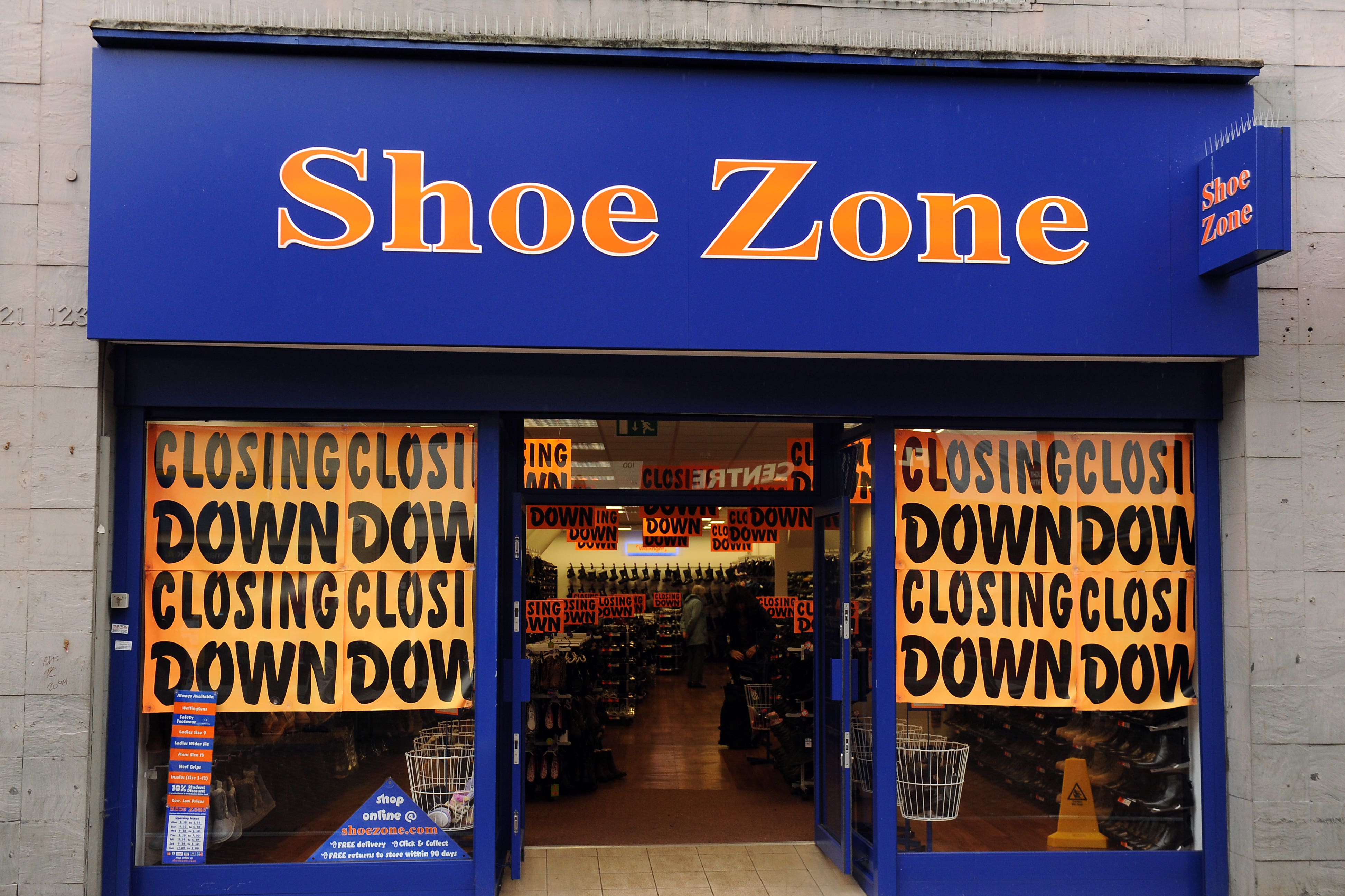 Retailer Shoe Zone revealed it has shut stores in response to soaring wage costs following the recent Budget measures as it warned over profits once again.