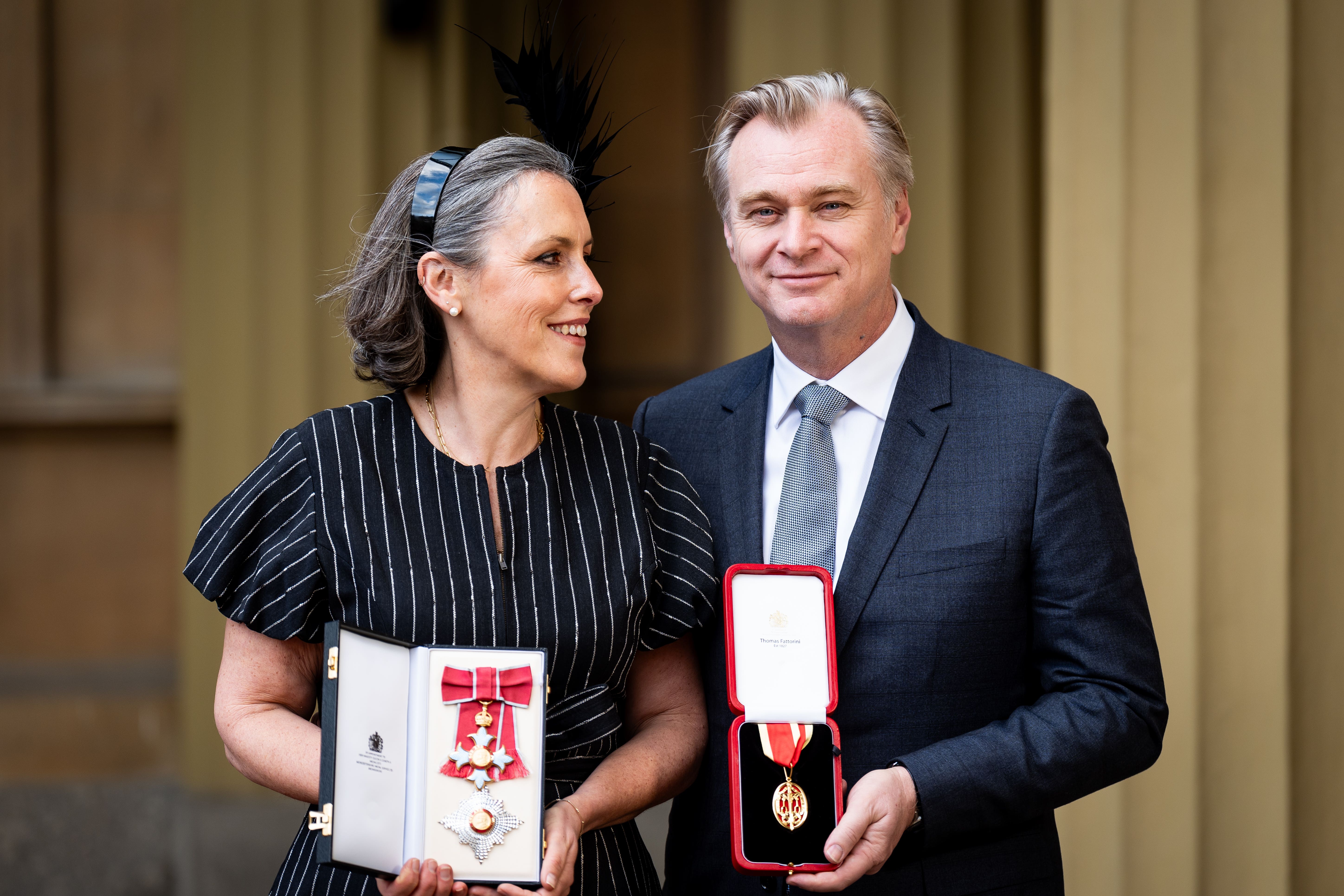 Emma Thomas and Christopher Nolan with their honours (Aaron Chown/PA)