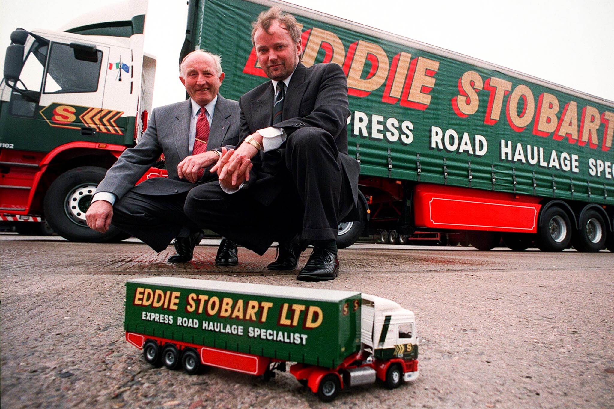 Eddie Stobart, pictured with late son Edward in front of one of the family firm’s lorries in 1993