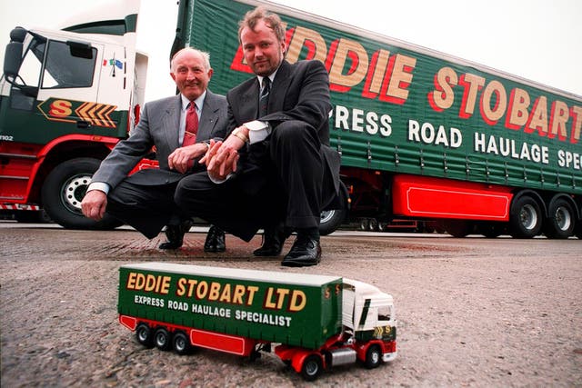 <p>Eddie Stobart, pictured with late son Edward in front of one of the family firm’s lorries in 1993  </p>