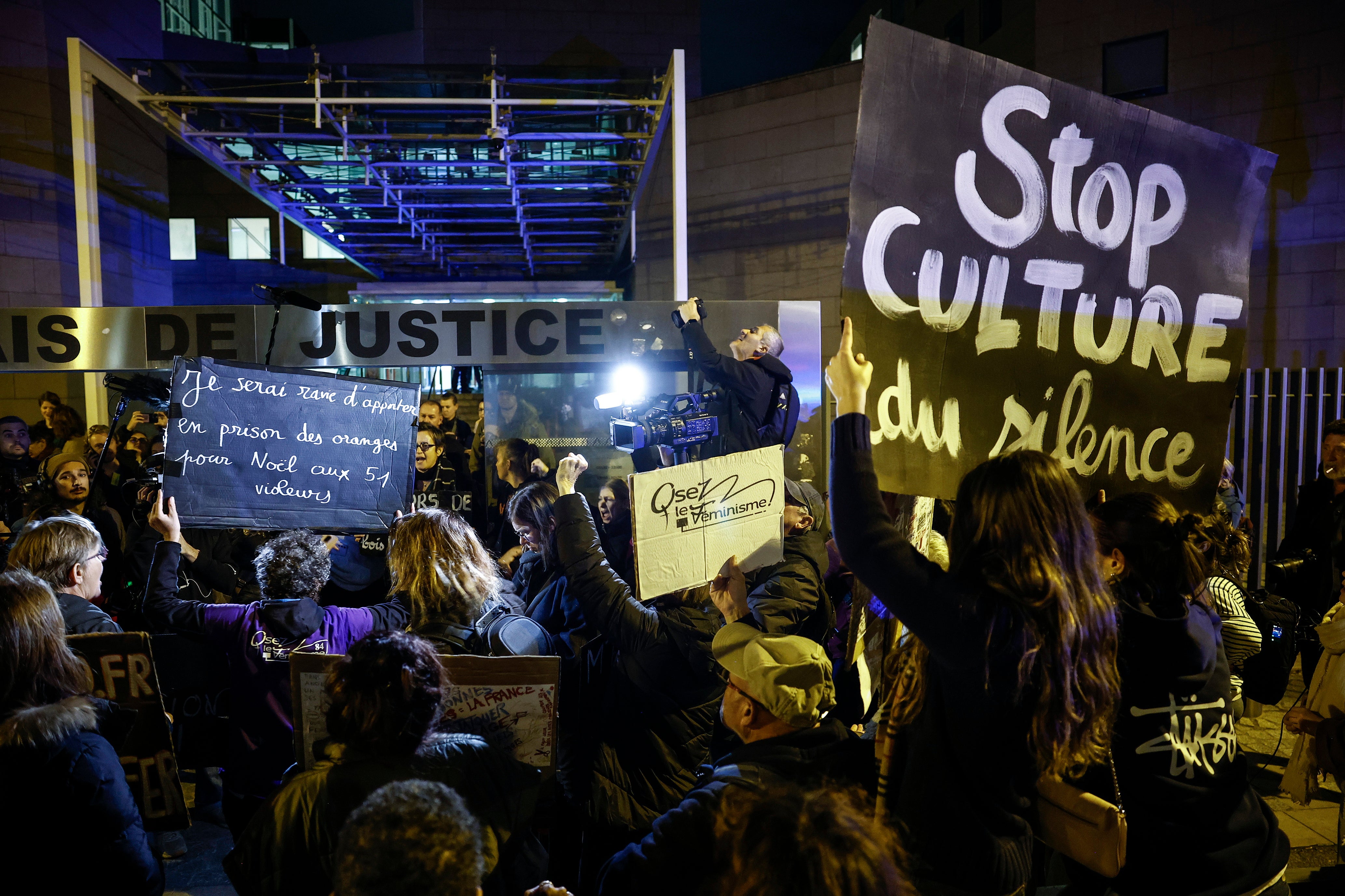 Activists demonstrate against sexual violence outside the criminal court in Avignon, France, 25 November