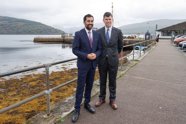 John Paul Marks, right, with then first minister Humza Yousaf (PA)