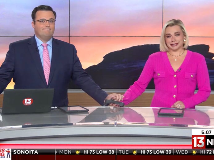 Co-anchors Tyler Butler and Carsyn Currier wear pink during broadcast in honor of their late colleague