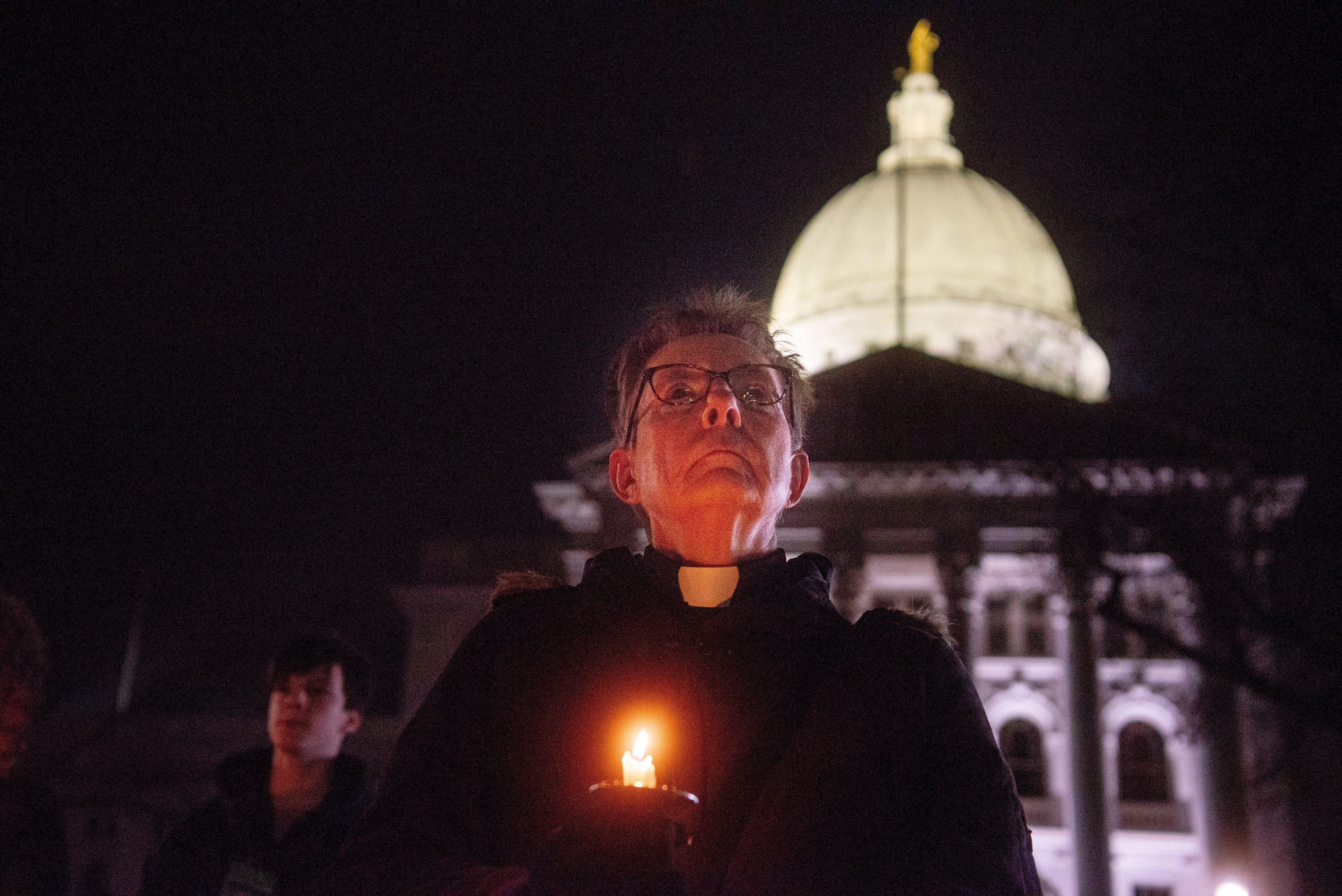 Mourners gather for a candlelight vigil at the Wisconsin State Capitol building a day after a shooting at Abundant Life Christian School, in Madison, Wisconsin, U.S. December 17, 2024. REUTERS/Cullen Granzen